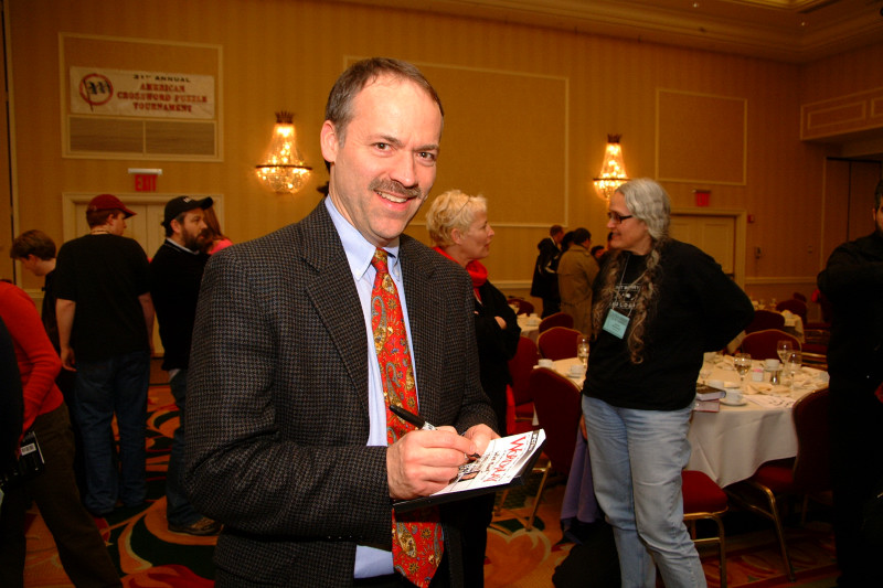 Will Shortz signs an autograph