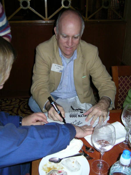 Vic Fleming signing one of his T-Shirts